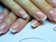 French manicure under a brown dress