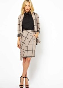 Asymmetrische rok met een coltrui en een kantoorjas