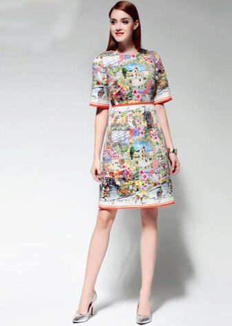 Fashionable dress of spring-summer 2016 with prints and inscriptions