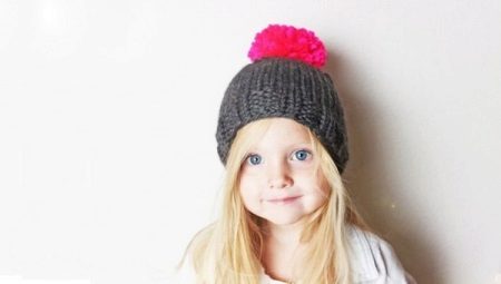 Children's hats with pompoms