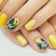 Features yellow manicure on short nails