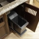 Retractable bins under the sink